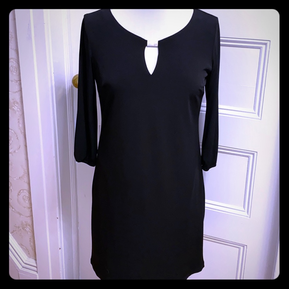 Never worn Donna Rico dress with keyhole. Size 6